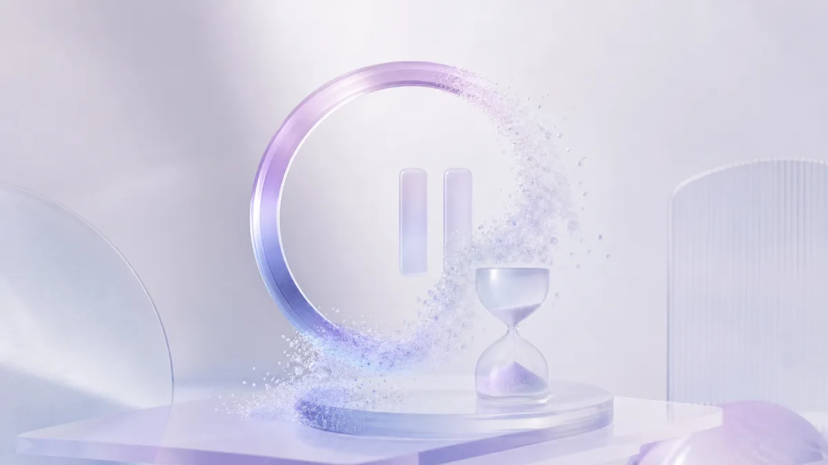A glass ring dissolving into particles beside an hourglass, with pause bars in the middle